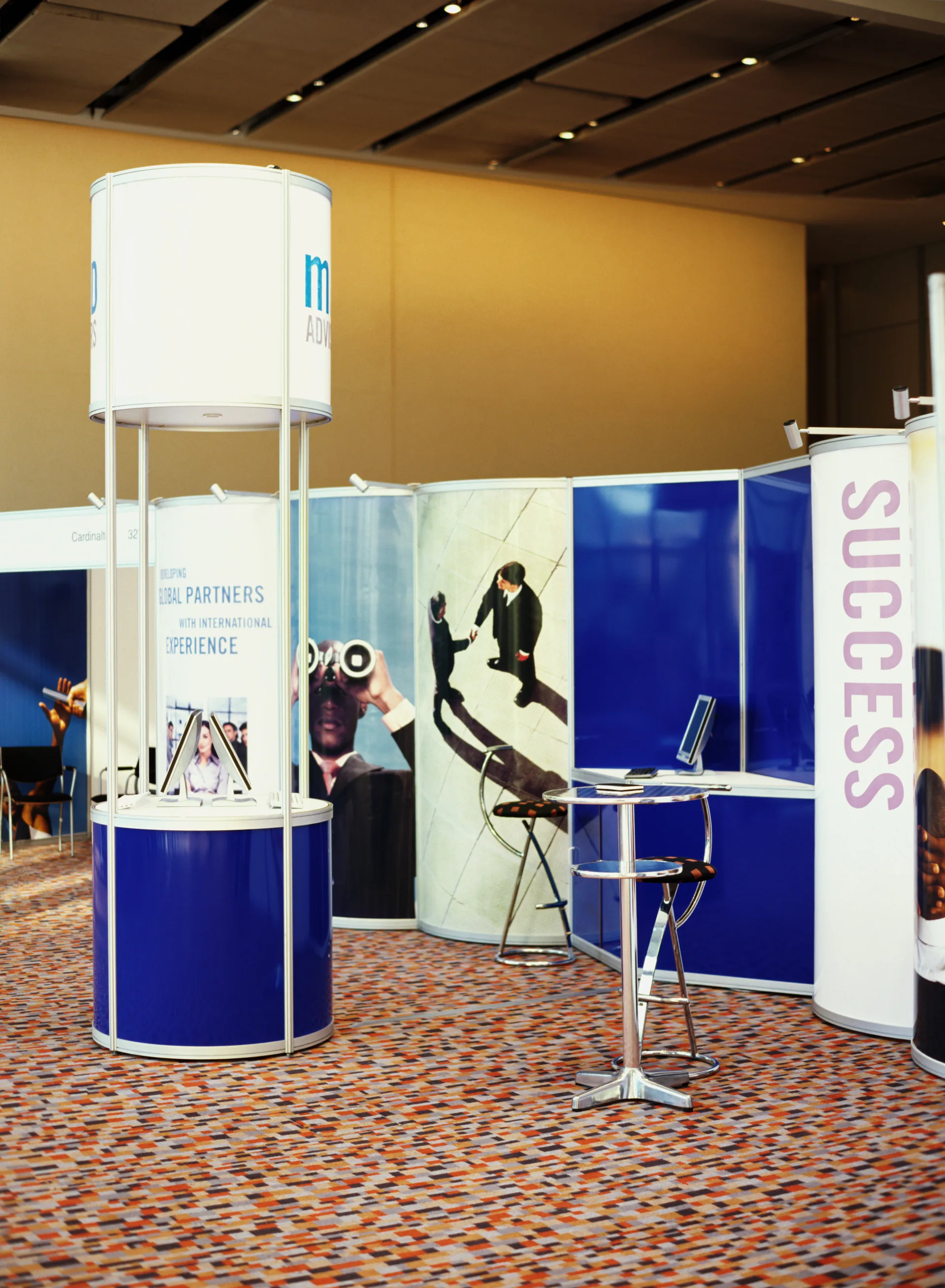 Trade show exhibit booths with branded signage and displays